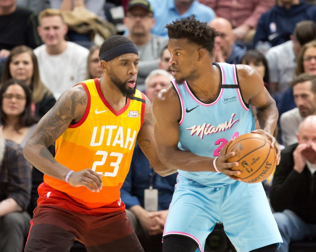 Royce O'Neale (23) guards Jimmy Butler (22)